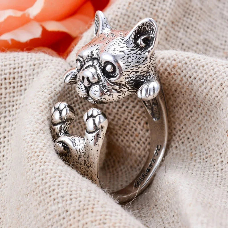 charming french bulldog silver ring elegant gift for women. Silver dog-shaped ring on a finger with a blurred background 3