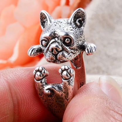charming french bulldog silver ring elegant gift for women. Silver dog-shaped ring on a finger with a blurred background 2