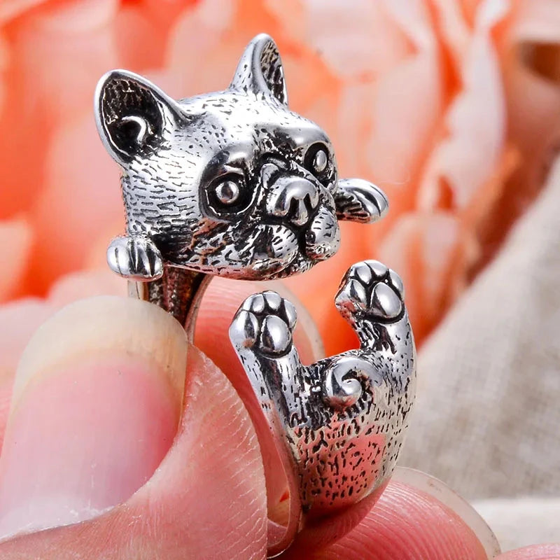 charming french bulldog silver ring elegant gift for women. Silver dog-shaped ring on a finger with a blurred background 5