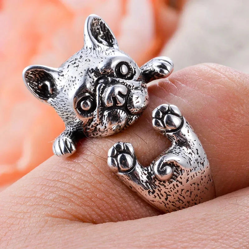 charming french bulldog silver ring elegant gift for women. Silver dog-shaped ring on a finger with a blurred background 5